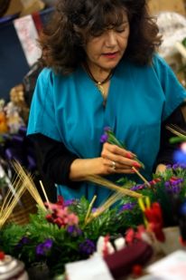 NATALIE BATTAGLIA | THE TIMES Helen Williams, of Williams Florist in Highland, creates...